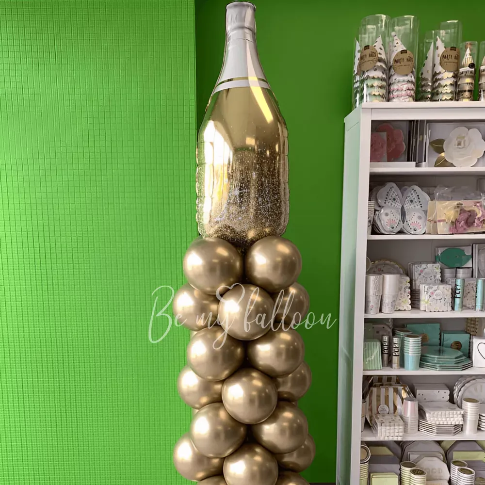 Chrome pillar with a Champagne bottle balloon composition
